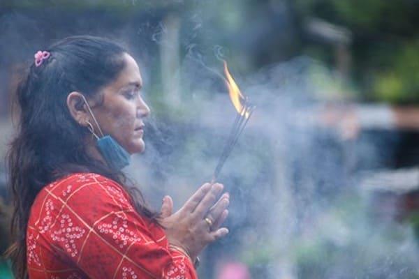 Nepali using incense for prayer in Nepal