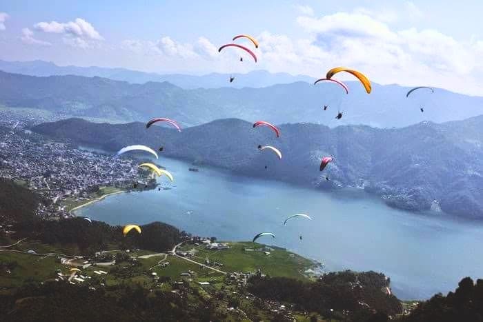 People paragliding over Lakeside in Pokhara