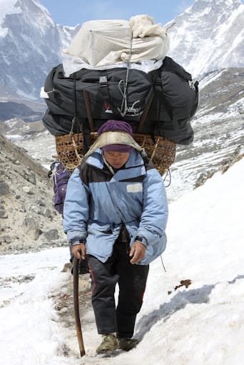 Porter carrying gear on Everest