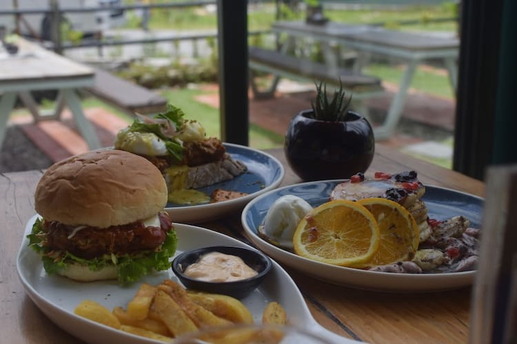 Calm's Berry pancake, Pulled Pork Benedict and the Crispy Buffalo Chicken Burger